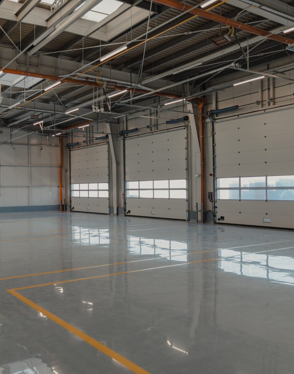 Epoxy and waxed flooring with colorful signage in car service
